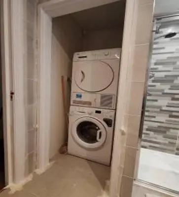 a washer and dryer in a small room at Lakeside View in Southport