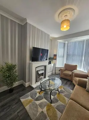 a living room with a couch and a fireplace at City Centre - Comfy 6 beds - Up to 30 percent off - Contractors delight in Liverpool