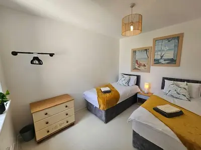 a bedroom with two beds and a camera on the wall at City Centre - Comfy 6 beds - Up to 30 percent off - Contractors delight in Liverpool