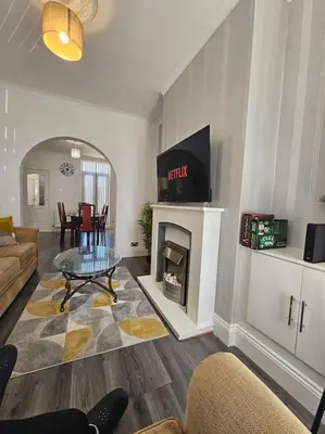 a living room with a couch and a fireplace at City Centre - Comfy 6 beds - Up to 30 percent off - Contractors delight in Liverpool