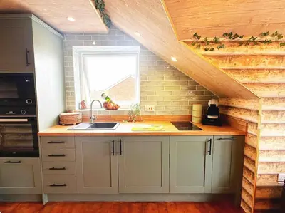 a kitchen with a counter with a sink and a window at Squirrel Hideaway with Hot Tub in Formby, Liverpool in Formby