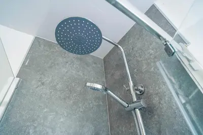 a shower with a shower head in a bathroom at Majestic House Liverpool in Liverpool