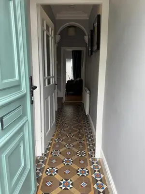 a hallway with a tile floor and a door at Four Bedroom High Spec Victorian Townhouse in Clitheroe