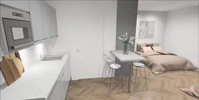 a white kitchen with a bed and a sink at 8 Water Street in Liverpool