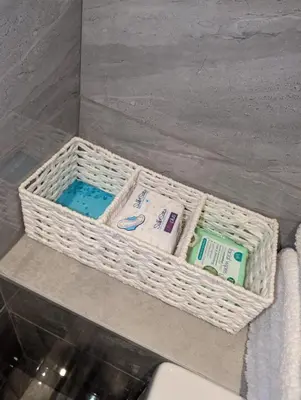 a basket of toiletries sitting on a counter in a bathroom at 8 Water Street in Liverpool