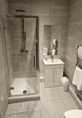 a bathroom with a shower and a sink at 8 Water Street in Liverpool