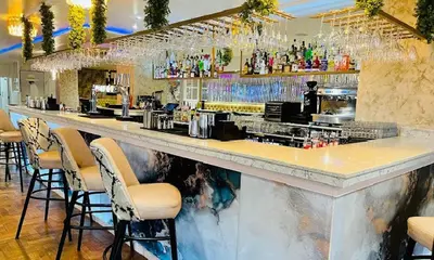 a bar in a restaurant with bar stools at 8 Water Street in Liverpool