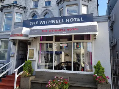a white building with a sign for a hotel at The Withnell Hotel in Blackpool