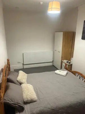 a bedroom with a bed in a room at Fir Trees in Blackpool