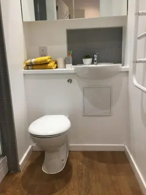 a bathroom with a white toilet and a sink at Liverpool Georgian Quarter in Liverpool
