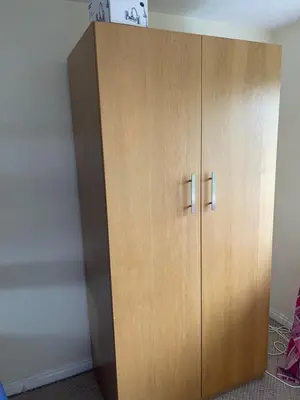 a large wooden cabinet in a room at Wavertree Accomodation in Liverpool