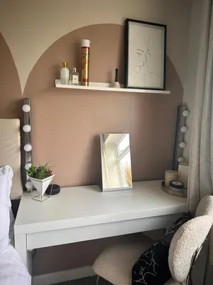 a shelf in a bedroom with a mirror on it at Everythings Rosey at Rosecroft in Ormskirk