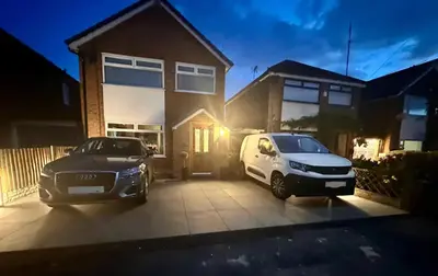 two cars parked in front of a house at Everythings Rosey at Rosecroft in Ormskirk
