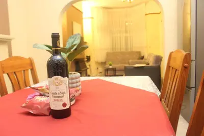 a bottle of wine sitting on top of a table at mater dei suite near royal liverpool hospital in Liverpool