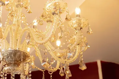 a gold chandelier hanging from a ceiling at Hotel Rouge in Blackpool