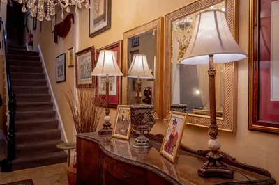 a room with a table with two lamps and a mirror at Hotel Rouge in Blackpool