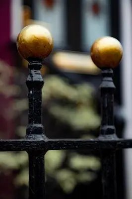 two balls on top of a black fence at Hotel Rouge in Blackpool