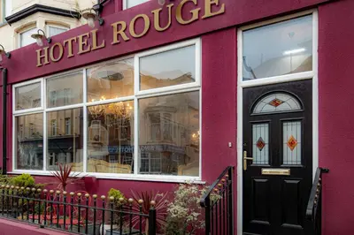 a red building with a hotel rouge written on it at Hotel Rouge in Blackpool