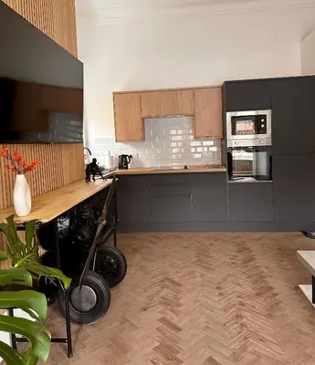 a kitchen with a counter and a stove top oven at No1,luxury 1 bed apartment in Saint Annes on the Sea