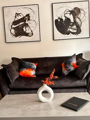 a living room with a couch and a vase on a table at No1,luxury 1 bed apartment in Saint Annes on the Sea