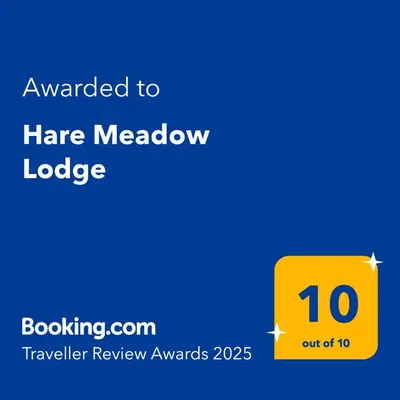 a yellow sign with a hate meow label at Hare Meadow Lodge in Mellor