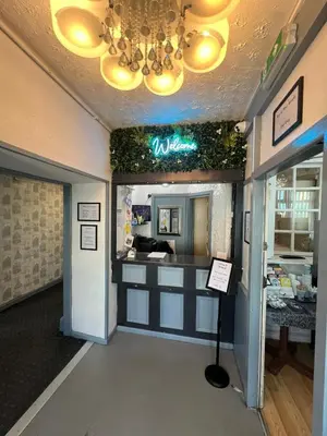 a restaurant with a counter in a room at Henson hotel in Blackpool