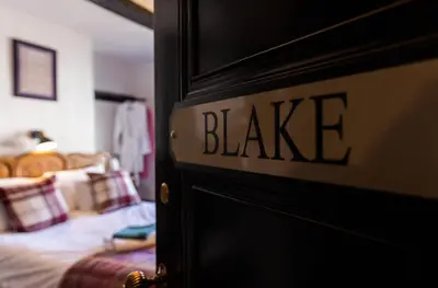 a door with the word blaze written on it in a bedroom at The Kings Arms in Cartmel