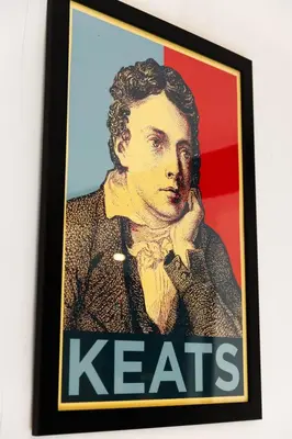 a framed picture of a man in a suit and tie at The Kings Arms in Cartmel