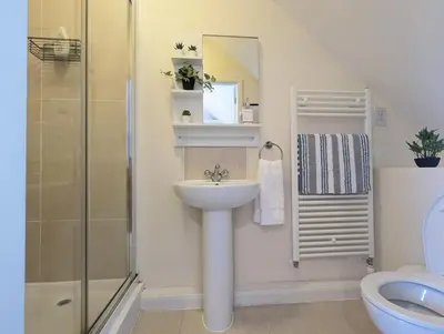 a bathroom with a sink and a shower at Large 4-Bedrooms House Near Centre Free Parking in Liverpool