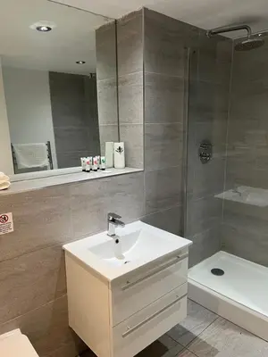 a bathroom with a sink and a shower at 5 Halifax House, apartment 3 in Liverpool