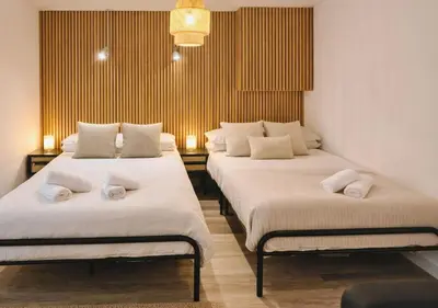 a room with three beds with towels on them at Manhattan Suites Near Liverpool ONE sleeps 4 in Liverpool