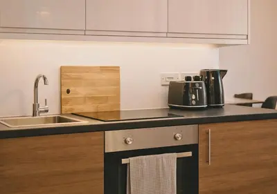 a kitchen with a sink and a counter top at Manhattan Suites Near Liverpool ONE sleeps 4 in Liverpool