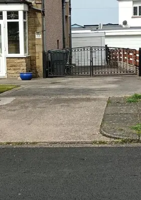 an empty street in front of a building at Sea View in Heysham