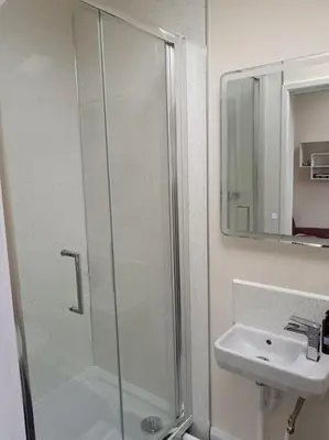 a bathroom with a shower and a sink at Sea View in Heysham