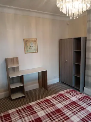 a room with a desk and a book shelf at Sea View in Heysham
