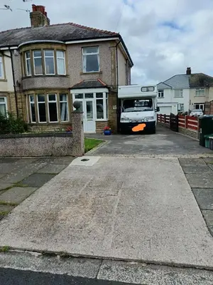 a bus parked in the driveway of a house at Sea View in Heysham