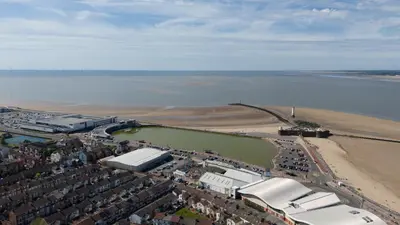 an aerial view of a city and the beach at Comfy 5 star Stays - 6 Bedrooms - Sleeps 8 - Free Parking & WiFi - Wirral in New Brighton