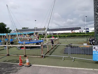 a tennis court with nets and people on it at 3-Bed Caravan - Haven Lakeland Leisure Park in Grange Over Sands