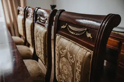 a row of wooden chairs sitting next to a table at Grand Victorian Villa 6 - En-Suites, Hot Tub, Cinema Room, Private Parking & Park View in Liverpool