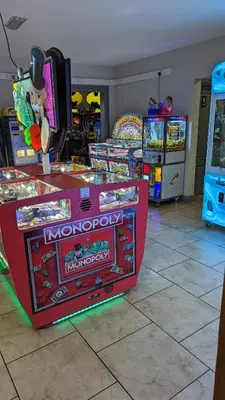 a video game arcade in a room with other games at Lake View - Beacon Fell View Holiday Park in Longridge
