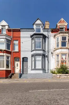 a large white house on the side of a street at Residency apartments Liverpool in Liverpool