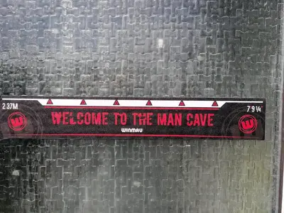 a sign that says welcome to the man cave at Affluent Living Property perfect for contractors and individuals in Wigan