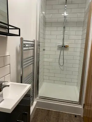a bathroom with a shower and a sink at Clock Tower Apartment No4 in Morecambe