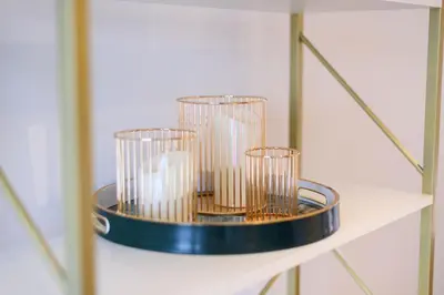 a shelf with three glass cups on it at Stunning Liverpool City Location with River View and parking space included in Liverpool