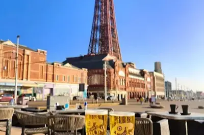 two glasses of beer on a table in front of the eiffel tower at Seaside - House - Sleeps 10 - Parking - Garden in Blackpool