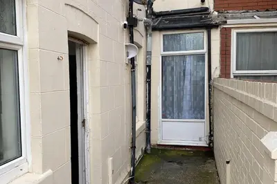 an entrance to a building with a door at Seaside - House - Sleeps 10 - Parking - Garden in Blackpool