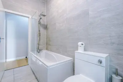 a white bathroom with a toilet and a shower at #6 - Vibrant apartment in City Centre - Sleeps 7 - Exclusive offers at a-kapartments in Liverpool