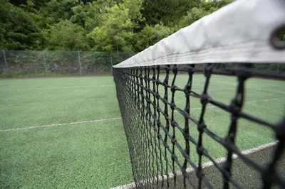a fence on the side of a soccer field at Cumbria Grand Hotel in Grange Over Sands