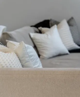 a bunch of pillows sitting on a couch at The Slipway Cabins with Hottub in Burscough