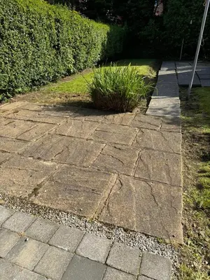 a stone walkway with a plant in the middle at 2 Bed Apartment Scarisbrick Street Ormskirk - Rooms by Vici in Ormskirk